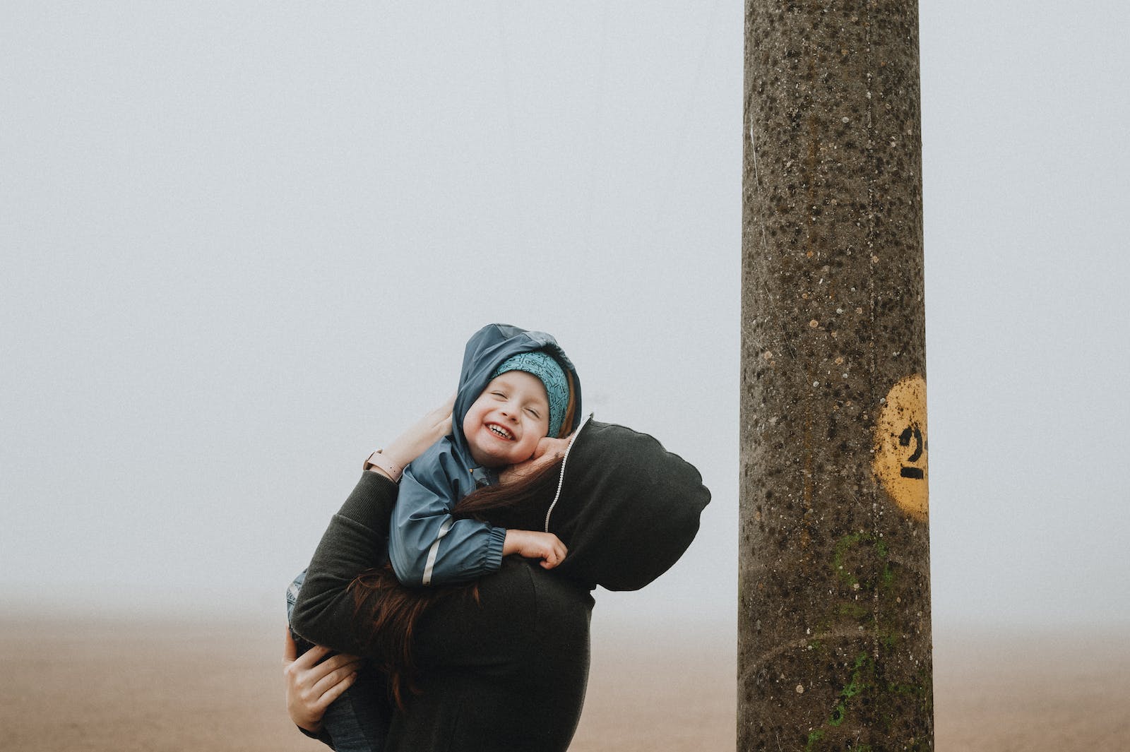 Parent and child walking together outdoors